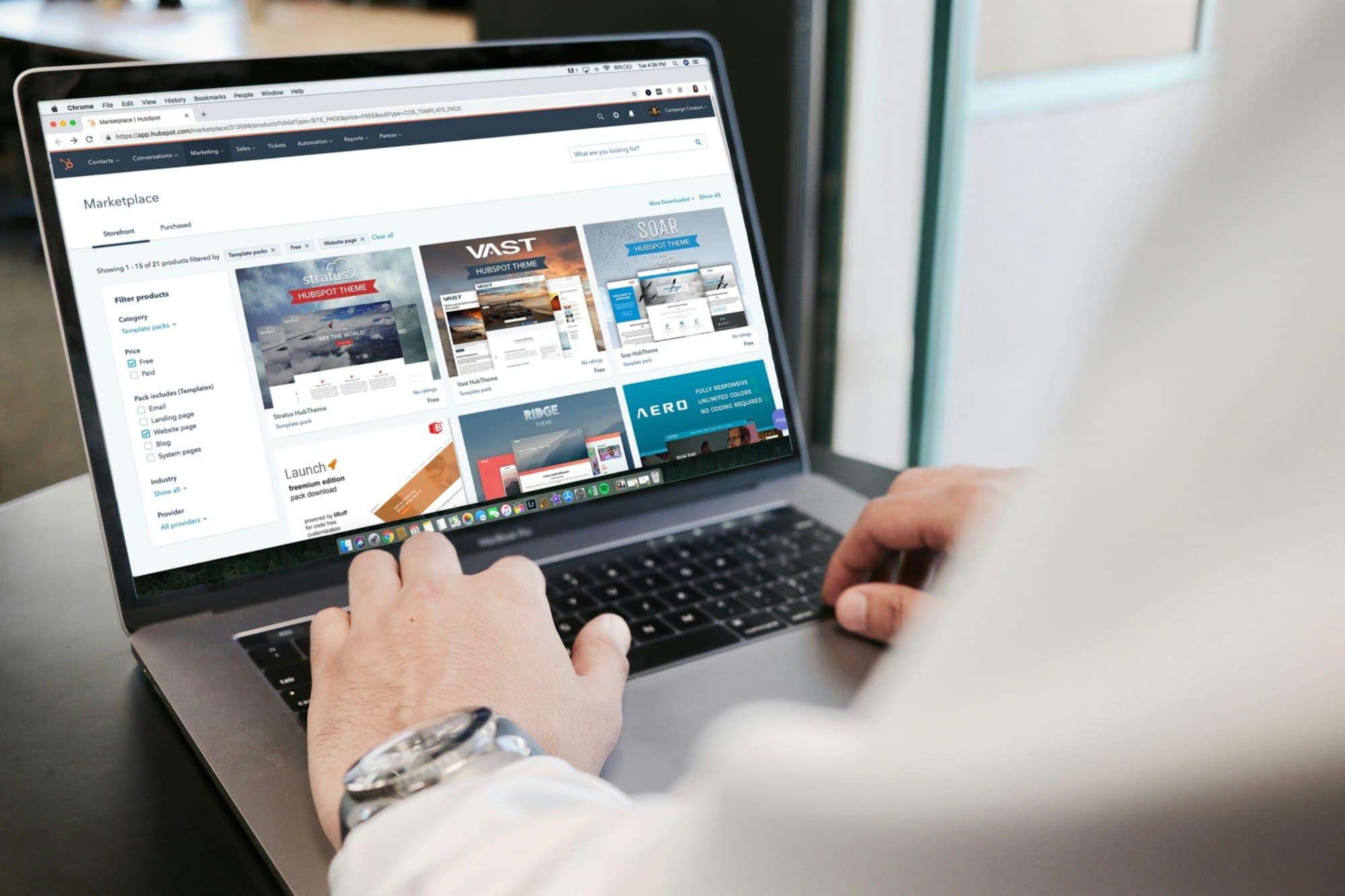 A person planning a website on a laptop at a desk