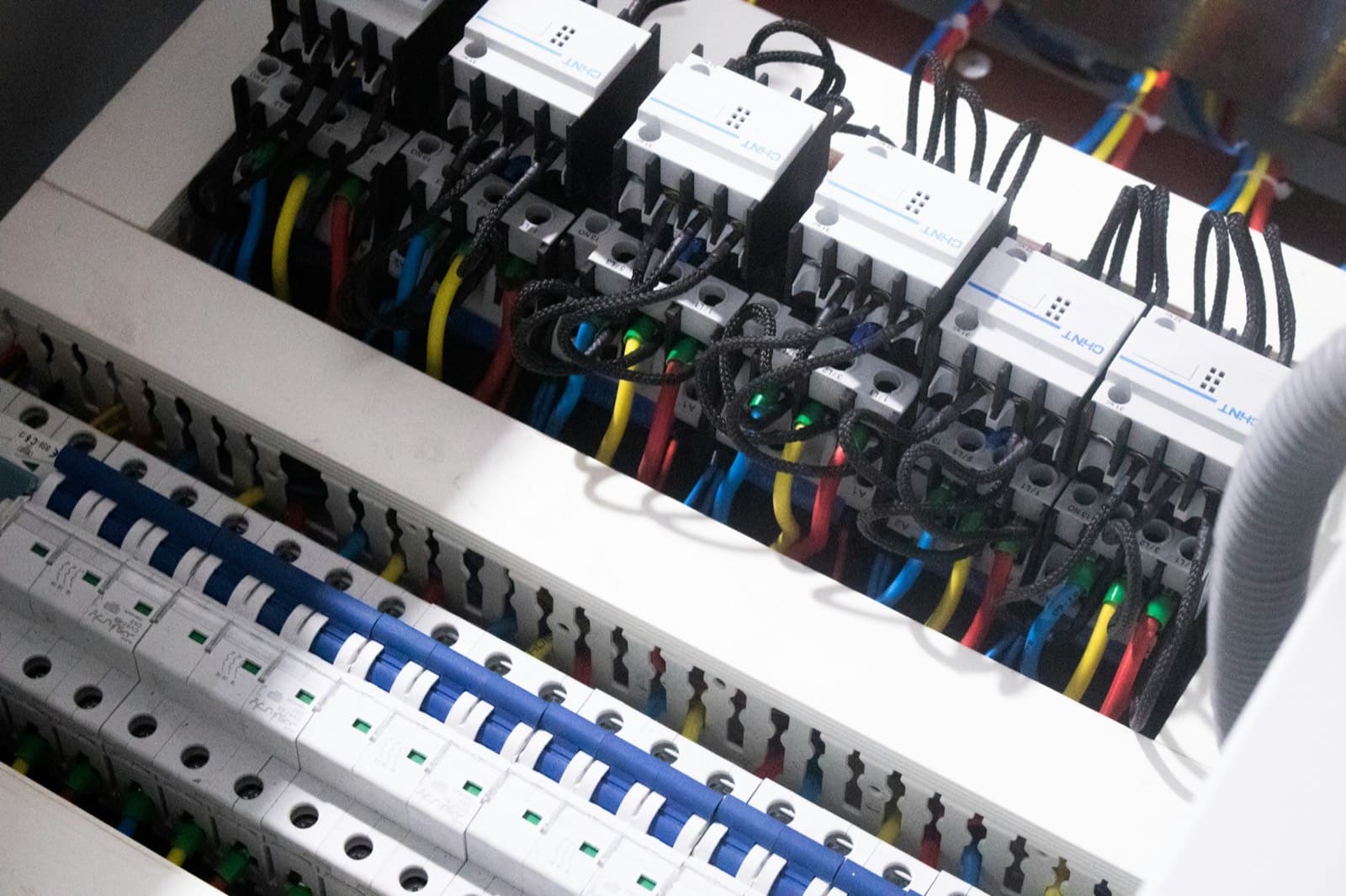 Colour-coded wiring inside a breaker panel