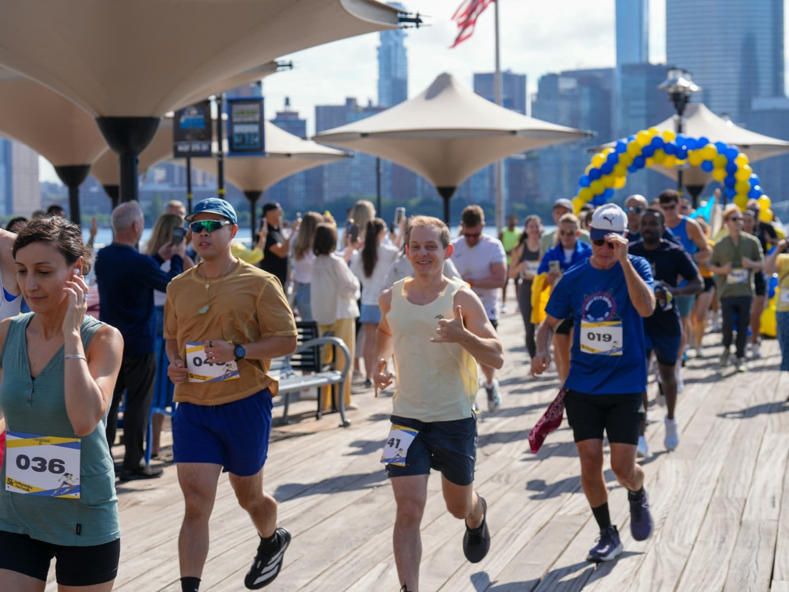 Runners taking part in a charity 5K race on a boardwalk